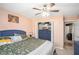 Bedroom with ceiling fan, closet, dresser and coordinated furnishings at 10312 Waterford Ne Rd, Covington, GA 30014