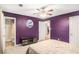 Bedroom features large bed, ceiling fan, closet, and adjoining bathroom at 10312 Waterford Ne Rd, Covington, GA 30014