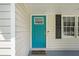 Teal front door with storm door at 10312 Waterford Ne Rd, Covington, GA 30014