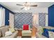 Cozy living room with blue wallpaper at 10312 Waterford Ne Rd, Covington, GA 30014