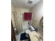 Cozy bathroom featuring tub/shower combo, vanity, and neutral decor at 2513 Rockwood Way, Stone Mountain, GA 30087