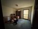 Bedroom featuring neutral walls, a window, and storage at 2513 Rockwood Way, Stone Mountain, GA 30087
