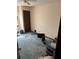 Bedroom with clutter, and blue carpet at 2513 Rockwood Way, Stone Mountain, GA 30087