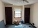 Bedroom with two closets and window in the middle needs decluttering at 2513 Rockwood Way, Stone Mountain, GA 30087
