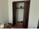 Bedroom closet with bifold louvered doors needs organization at 2513 Rockwood Way, Stone Mountain, GA 30087