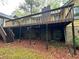 Back elevation showing the deck and brick underpinning at 2513 Rockwood Way, Stone Mountain, GA 30087