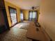Cozy dining area with access to outdoor patio, natural light, and a ceiling fan at 2513 Rockwood Way, Stone Mountain, GA 30087