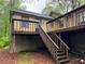 Exterior back elevation showing two decks and mature trees at 2513 Rockwood Way, Stone Mountain, GA 30087