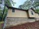 This angle emphasizes the foundation, blending nature and architecture at 2513 Rockwood Way, Stone Mountain, GA 30087