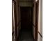 Hallway featuring neutral paint, trim, and doors at 2513 Rockwood Way, Stone Mountain, GA 30087