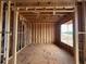 Interior framing of room with window showcasing the construction of new home at 3435 Dr Bramblett Rd, Cumming, GA 30028