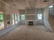 Unfinished living room with fireplace and bright windows at 3435 Dr Bramblett Rd, Cumming, GA 30028