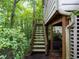 Backyard stairs up to deck with greenery at 3580 Treeline Ne Pass, Roswell, GA 30075