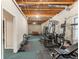 Basement with exercise equipment, pool table and open ceiling at 3580 Treeline Ne Pass, Roswell, GA 30075