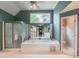 Primary bathroom features a garden tub, glass shower, and separate vanity area at 3580 Treeline Ne Pass, Roswell, GA 30075