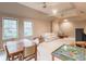 Large bonus room with multiple ceiling fans, natural light and space for dining and lounging at 3580 Treeline Ne Pass, Roswell, GA 30075