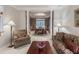 Elegant dining room featuring a chandelier, decorative wallpaper, and ample seating at 3580 Treeline Ne Pass, Roswell, GA 30075