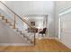 Inviting entryway with hardwood floors, staircase, and a view into the living room at 3580 Treeline Ne Pass, Roswell, GA 30075