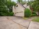 Home with a two car garage and extended driveway at 3580 Treeline Ne Pass, Roswell, GA 30075