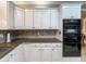 Bright kitchen with white cabinets, granite countertops and stainless steel appliances at 3580 Treeline Ne Pass, Roswell, GA 30075