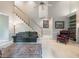 Comfortable living room with hardwood floors, a cozy couch, and staircase access at 3580 Treeline Ne Pass, Roswell, GA 30075