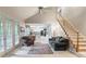 Spacious living room with hardwood floors, natural light, and staircase access at 3580 Treeline Ne Pass, Roswell, GA 30075