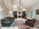 Inviting living room featuring high ceilings, a fireplace, and natural light at 3580 Treeline Ne Pass, Roswell, GA 30075