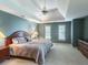 Inviting bedroom featuring a tray ceiling, neutral tones, and double windows at 3580 Treeline Ne Pass, Roswell, GA 30075