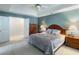 Comfortable bedroom with a tray ceiling, soft lighting, and spacious layout at 3580 Treeline Ne Pass, Roswell, GA 30075