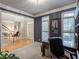 Inviting home office featuring natural light, a comfortable chair, and a view into the entry at 3580 Treeline Ne Pass, Roswell, GA 30075