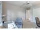 Cozy office with neutral walls, a glass desk and a nice view of nature at 3580 Treeline Ne Pass, Roswell, GA 30075