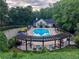 Beautiful community pool with sun deck and lounge chairs, surrounded by lush trees at 3580 Treeline Ne Pass, Roswell, GA 30075
