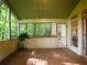 Charming screened-in porch with a view of the natural landscape, perfect for relaxation at 3580 Treeline Ne Pass, Roswell, GA 30075