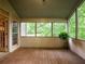 Inviting screened porch offering a tranquil outdoor space with views of the lush greenery at 3580 Treeline Ne Pass, Roswell, GA 30075
