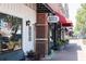 Charming storefront of R&M Hoagie Shoppe with a red awning and outdoor seating, inviting for a fresh seafood experience at 221 Village Overlook # H2, Canton, GA 30114