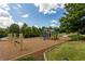 Community playground featuring swings, slides, and a safe play area at 221 Village Overlook # H2, Canton, GA 30114