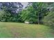 Picture of backyard with lush green grass and shed at 2290 Pope Rd, Douglasville, GA 30135
