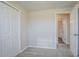 Carpeted bedroom with a double closet, and open doorway leading to en-suite bathroom at 2290 Pope Rd, Douglasville, GA 30135