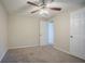Bedroom with neutral walls and carpet, view to hallway through doorway, and closet at 2290 Pope Rd, Douglasville, GA 30135
