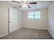 Bright bedroom with ceiling fan, carpet and entry doorway with adjoining room at 2290 Pope Rd, Douglasville, GA 30135