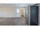 New wood-look flooring complements the stainless steel refrigerator, leading to the backyard at 2290 Pope Rd, Douglasville, GA 30135