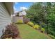 A view of the home's well maintained backyard featuring a grassy area, trees, and fence at 2499 Barrett Preserve Sw Ct, Marietta, GA 30064