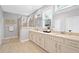 Luxurious bathroom featuring double sinks, granite countertops, and a glass-enclosed shower at 2499 Barrett Preserve Sw Ct, Marietta, GA 30064