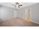 Bedroom with neutral carpet, fan and access to ensuite bathroom at 2499 Barrett Preserve Sw Ct, Marietta, GA 30064