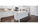 Bright, white kitchen with a central island and stainless steel appliances at 2499 Barrett Preserve Sw Ct, Marietta, GA 30064