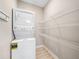 Bright laundry room, with built-in shelving and a stackable washer and dryer at 2499 Barrett Preserve Sw Ct, Marietta, GA 30064