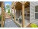 Outdoor patio area with stone ground cover, potted plants, and wooden beams at 2499 Barrett Preserve Sw Ct, Marietta, GA 30064