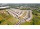 Aerial view of a residential community with well-maintained streets, landscaping and many homes at 2692 Pearl Ridge Trce, Buford, GA 30519