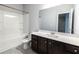 Well-lit bathroom with combined shower and tub, and a spacious vanity at 2692 Pearl Ridge Trce, Buford, GA 30519