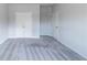 A spacious bedroom with plush carpeting is enhanced by the natural light and ample closet space at 2692 Pearl Ridge Trce, Buford, GA 30519